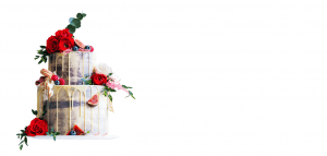 A white cake with flowers on top of it.