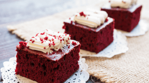 A close up of two red velvet cakes