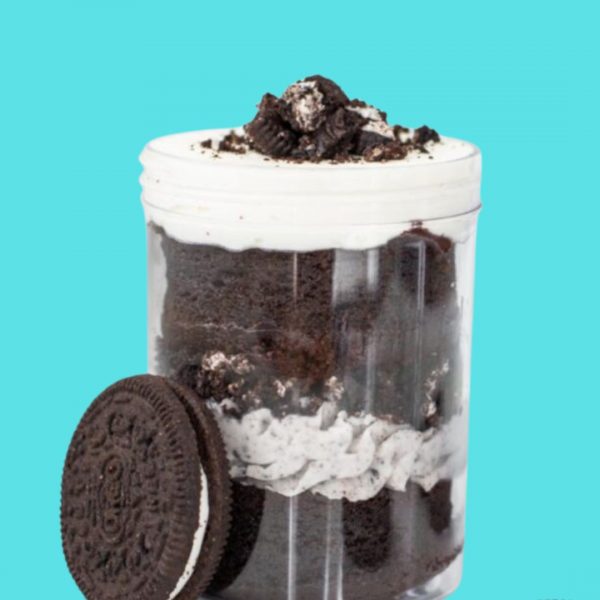 A container of cookies and cream with an oreo cookie.