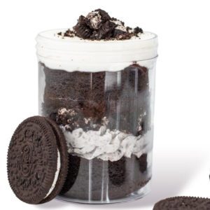 A jar of cookies and cream with an oreo cookie.