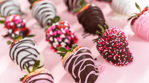 A close up of several chocolate covered strawberries.
