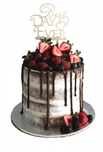 A cake with chocolate frosting and berries on top.