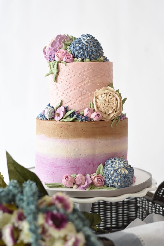 A cake with flowers on top of it.