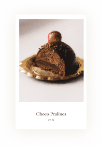 A chocolate dessert with a cherry on top.